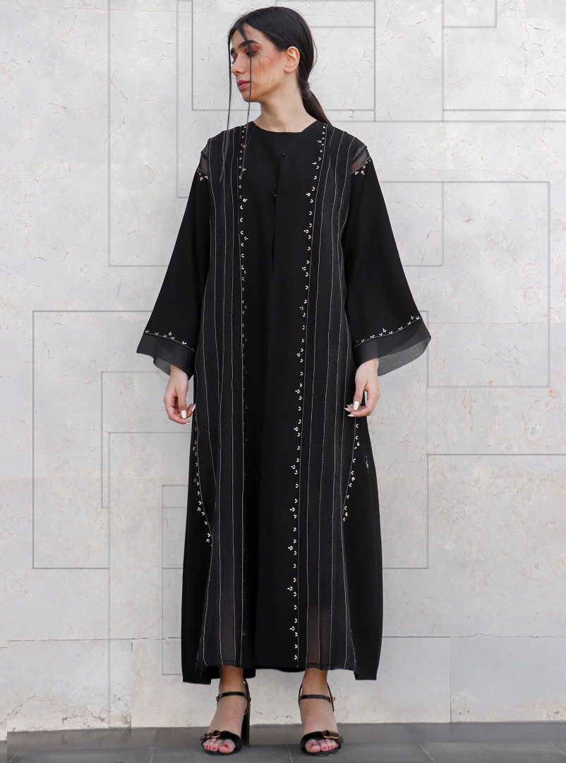 Code:SK11 Abaya Black abaya with tulle trimmings, adorned with delicate ...
