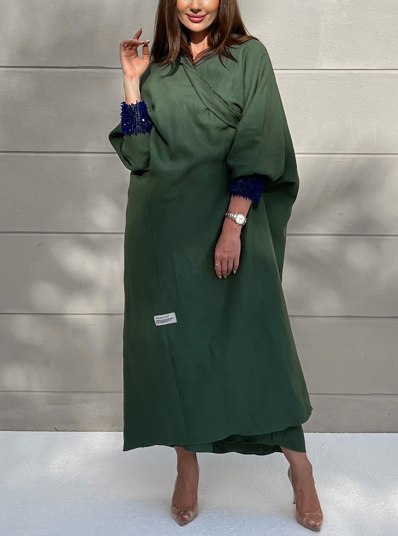 MRMR Abaya An oversized abaya in subdued green, with fringed trimmings ...
