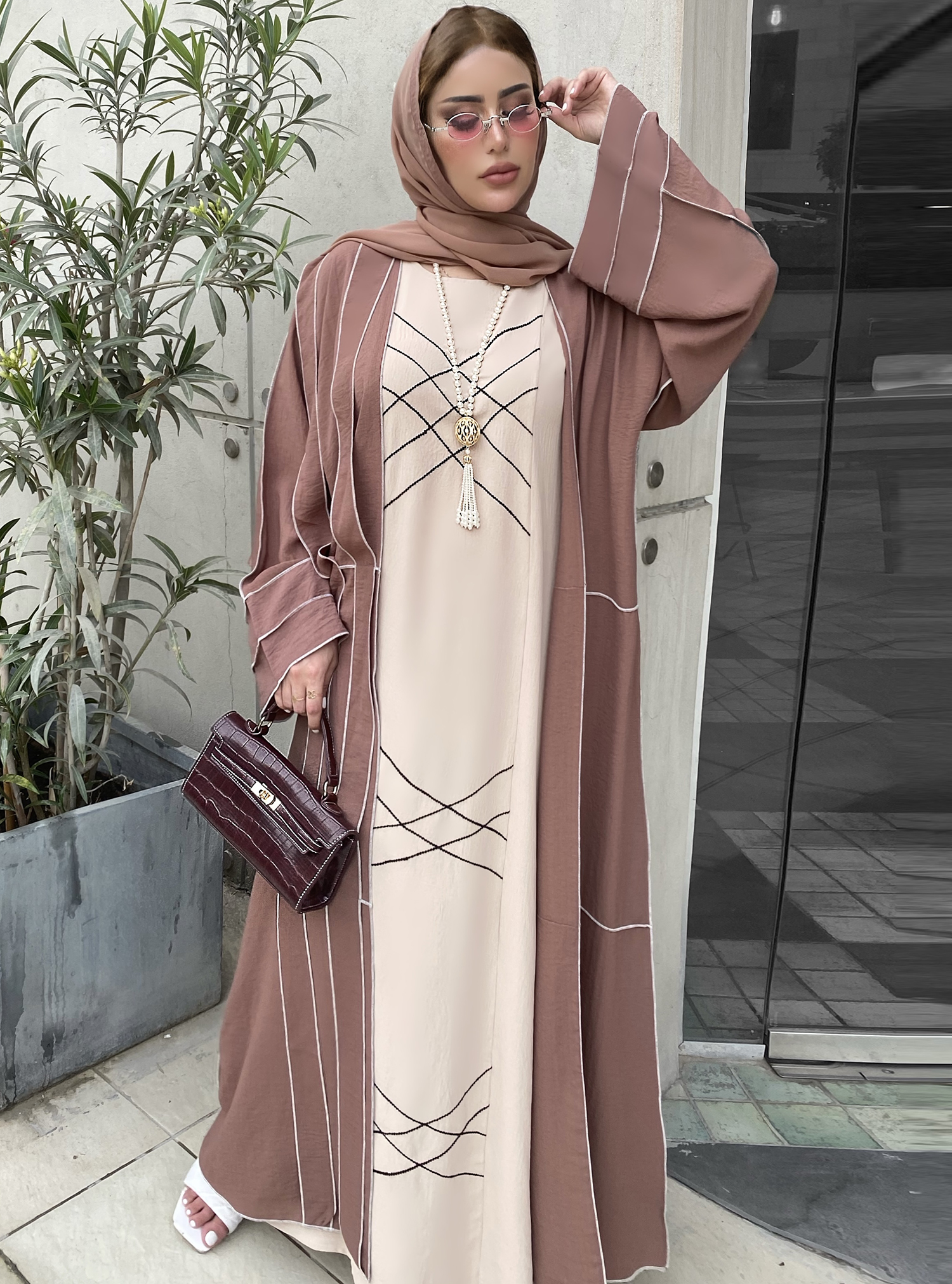 Brown and Beige Dress Two-Piece Abaya Set, with Black Embroidery Details On The Inner Dress.