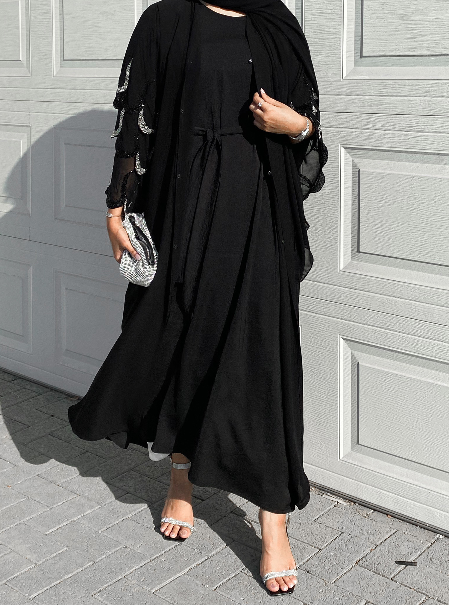 Chiffon Abaya Black double-layered chiffon abaya in a classic silhouette  adorned with embellishments. Abayas from Cle Fashion at Boksha
