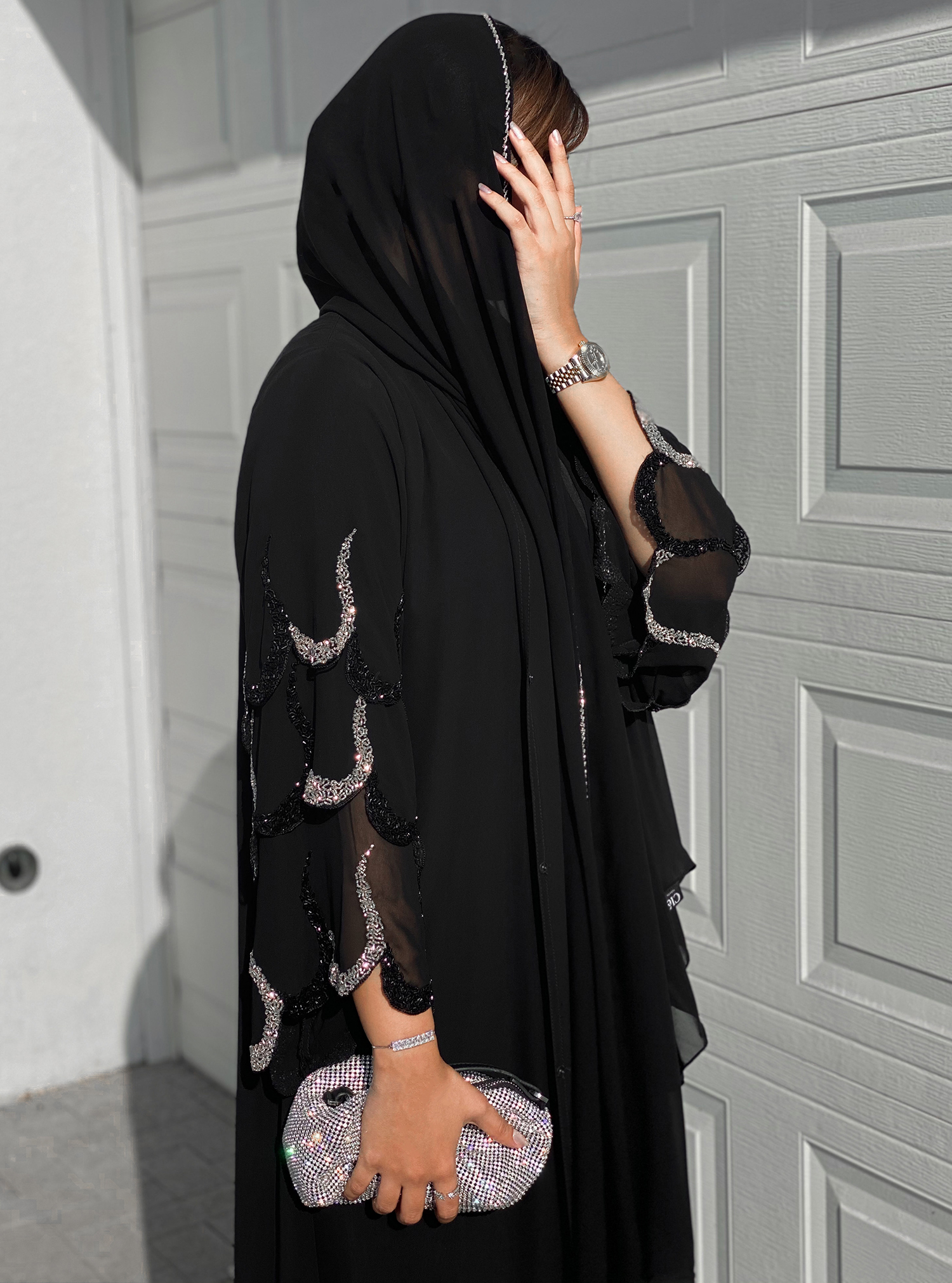 Chiffon Abaya Black double-layered chiffon abaya in a classic silhouette  adorned with embellishments. Abayas from Cle Fashion at Boksha