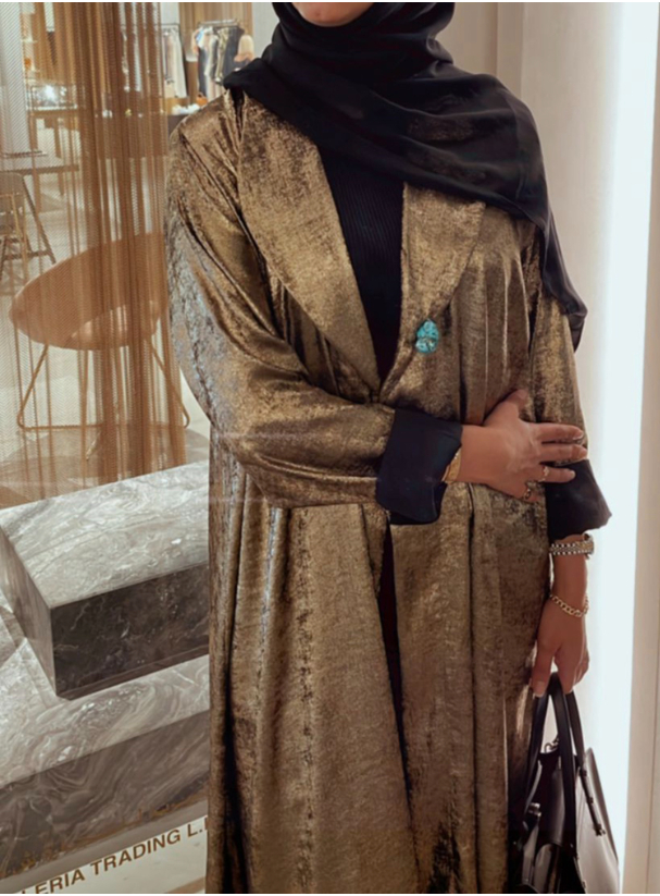 Gold abaya Reflective gold abaya with collar. Comes with a headscarf ...