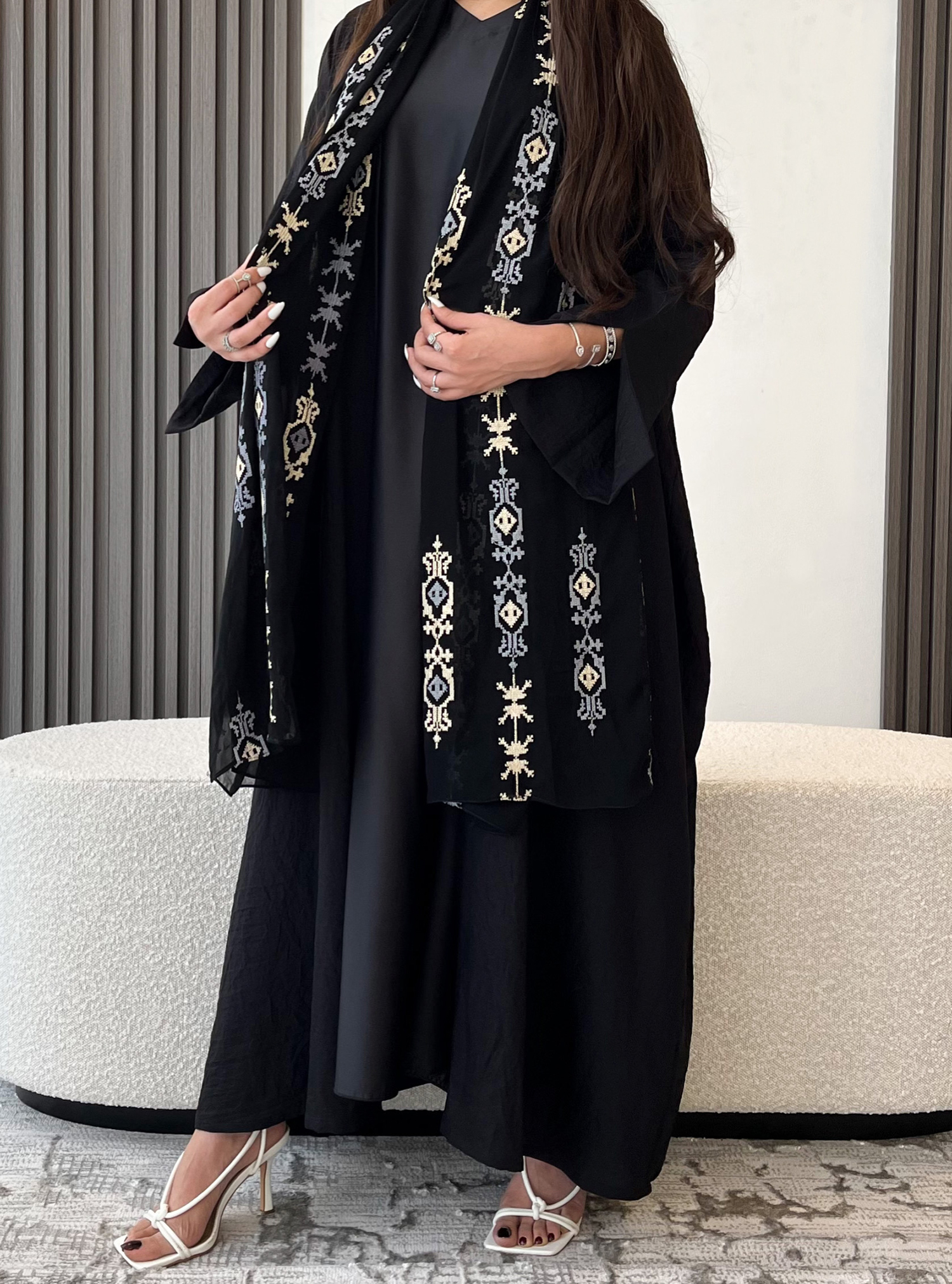 Stylish Abaya A black abaya with an opening sleeves, featuring a ...