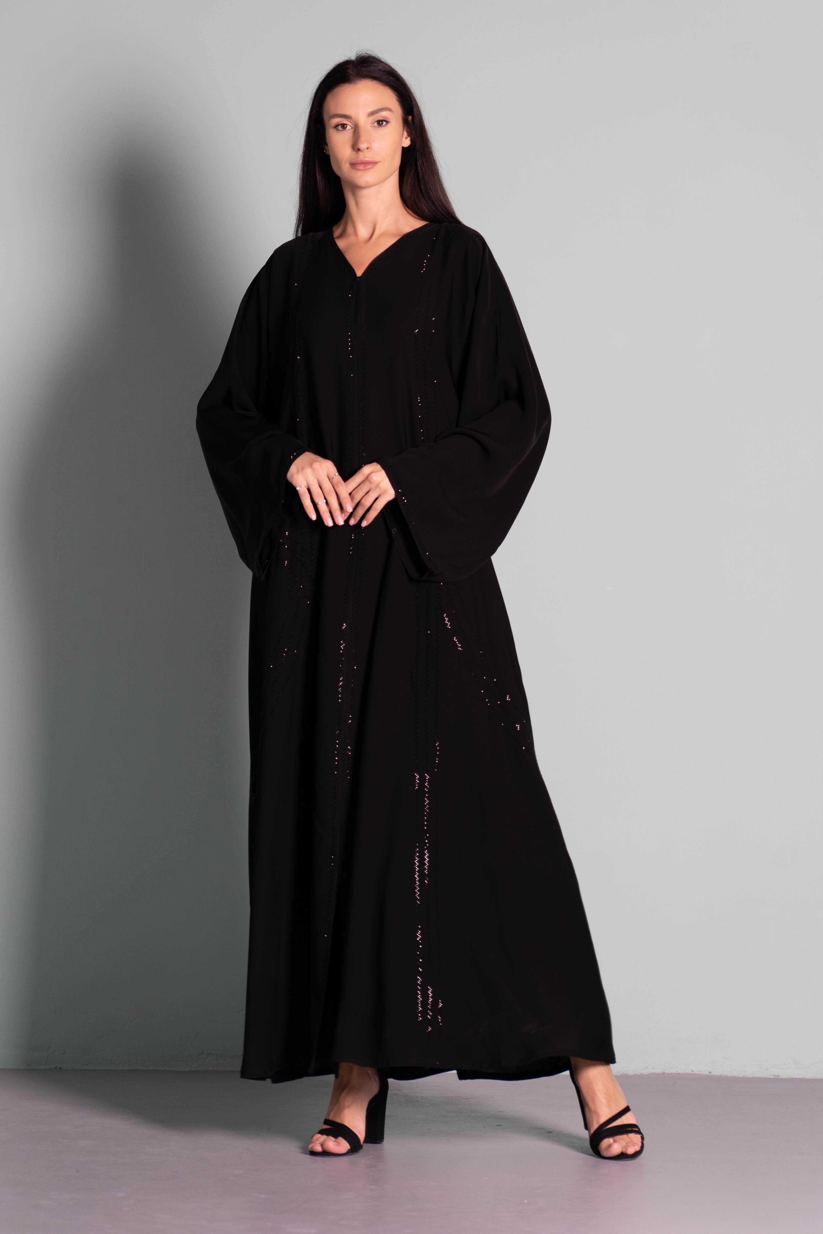 NIDHA BLACK Black abaya with dainty embellishments. Comes with a ...