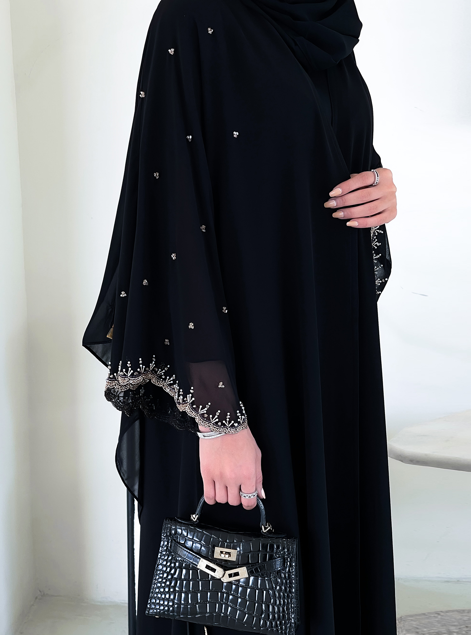 P66Duble shifon Black abaya with pleated back detail, adorned with ...