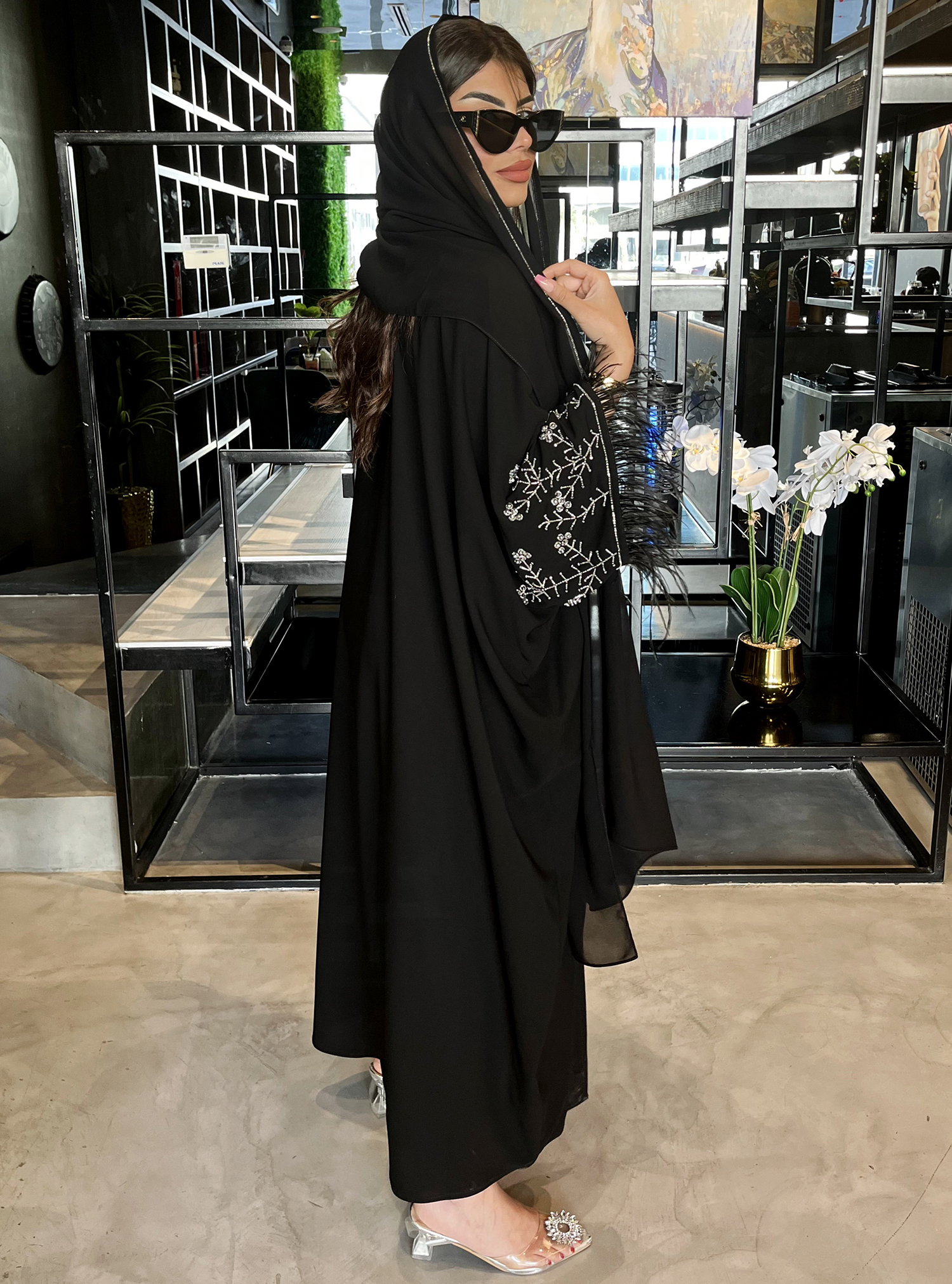 Black & feather Black abaya with wide sleeves, adorned with ...