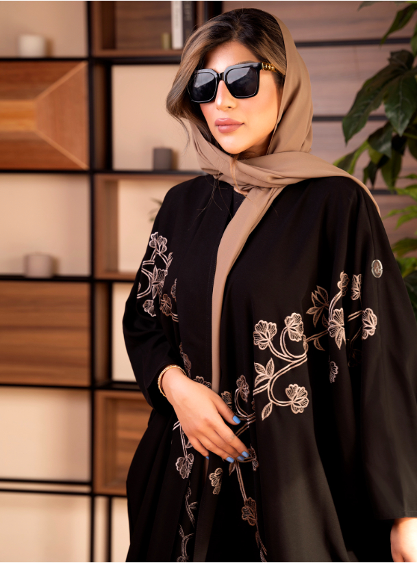 Caramel & Black Black abaya with flower embroidery. Comes with a
