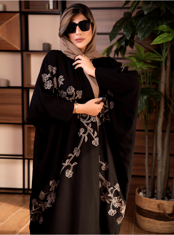 Caramel & Black Black abaya with flower embroidery. Comes with a