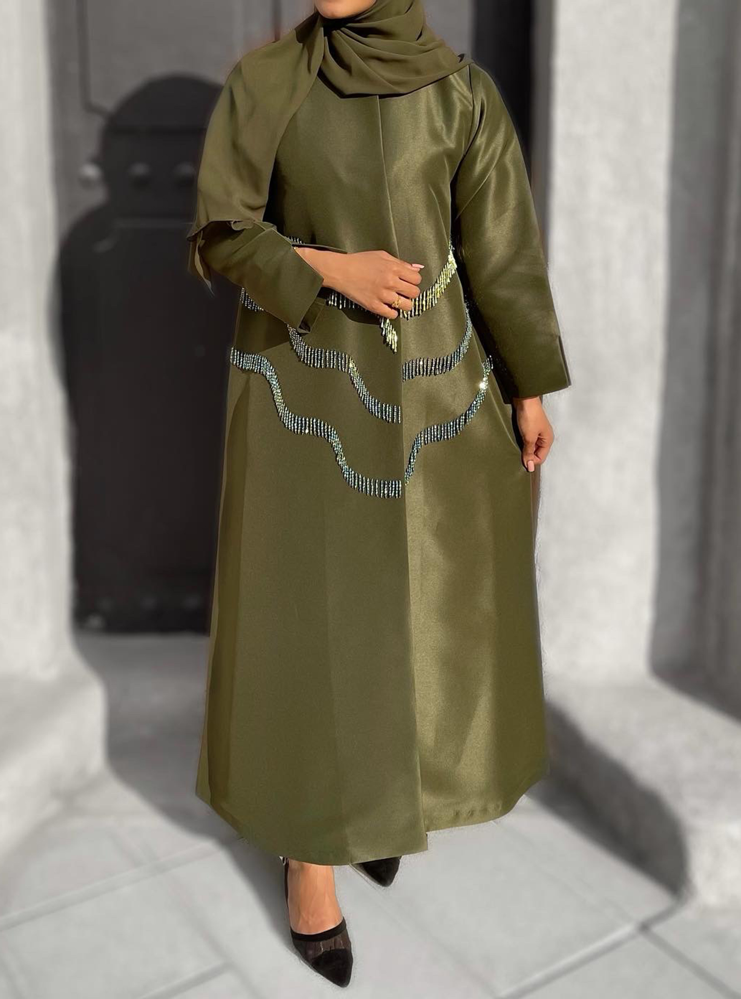 GREEN ABAYA Olive green abaya adorned with embellishments. Comes with a