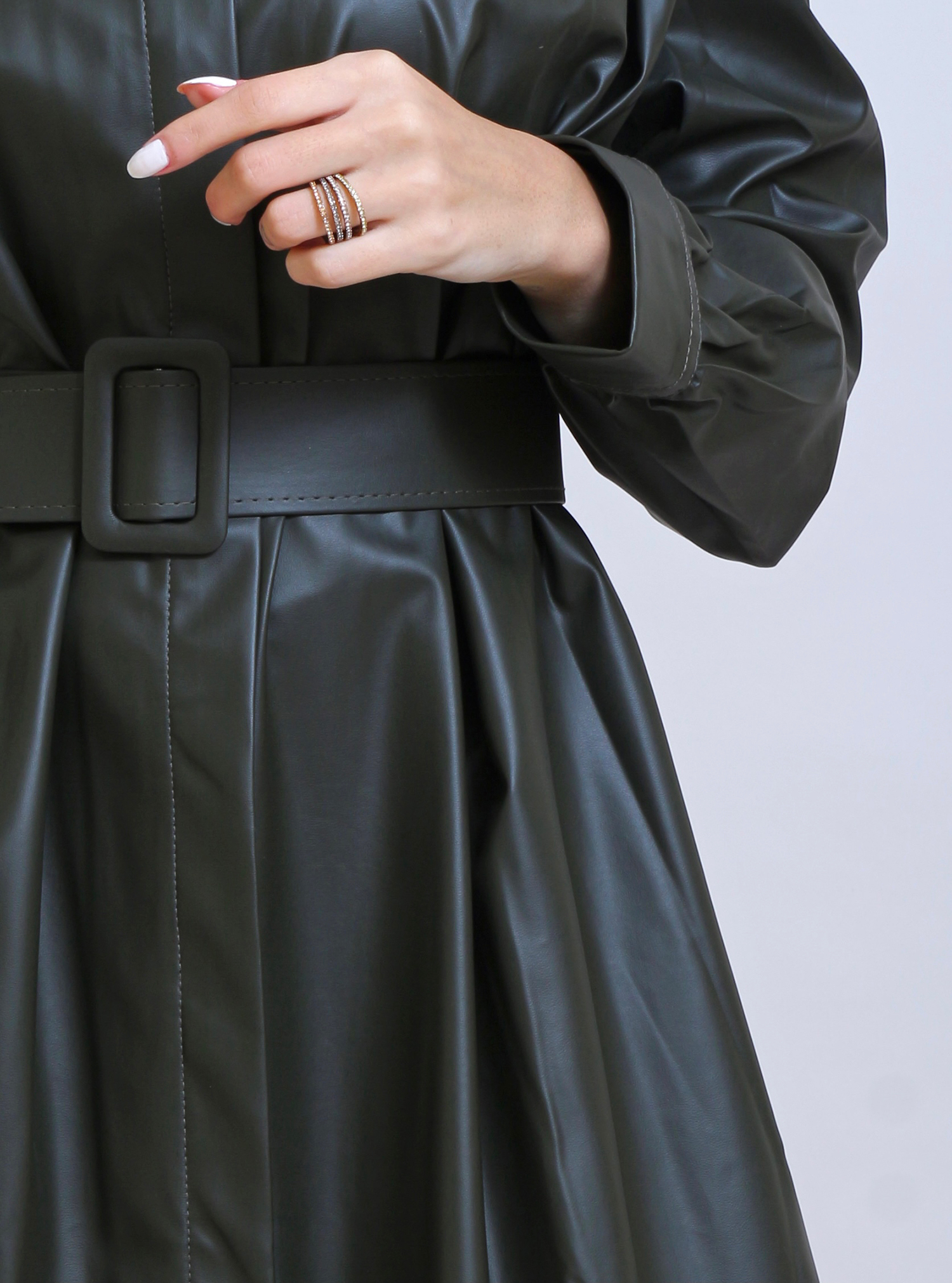 Dark green faux leather coat dress with cuffed sleeves. Comes with a belt..