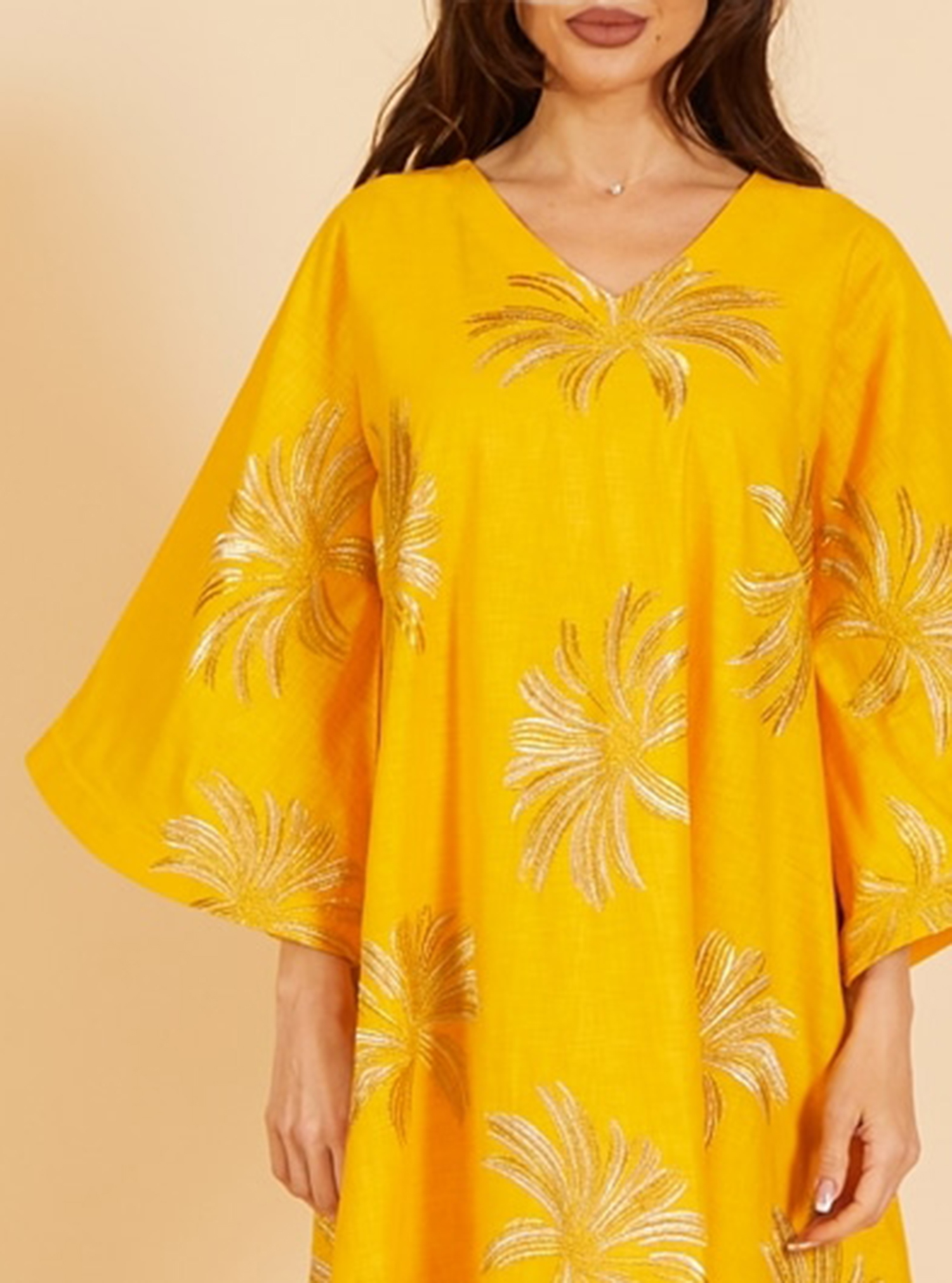 Linen Kaftan An elegant linen kaftan, featuring a beautiful and