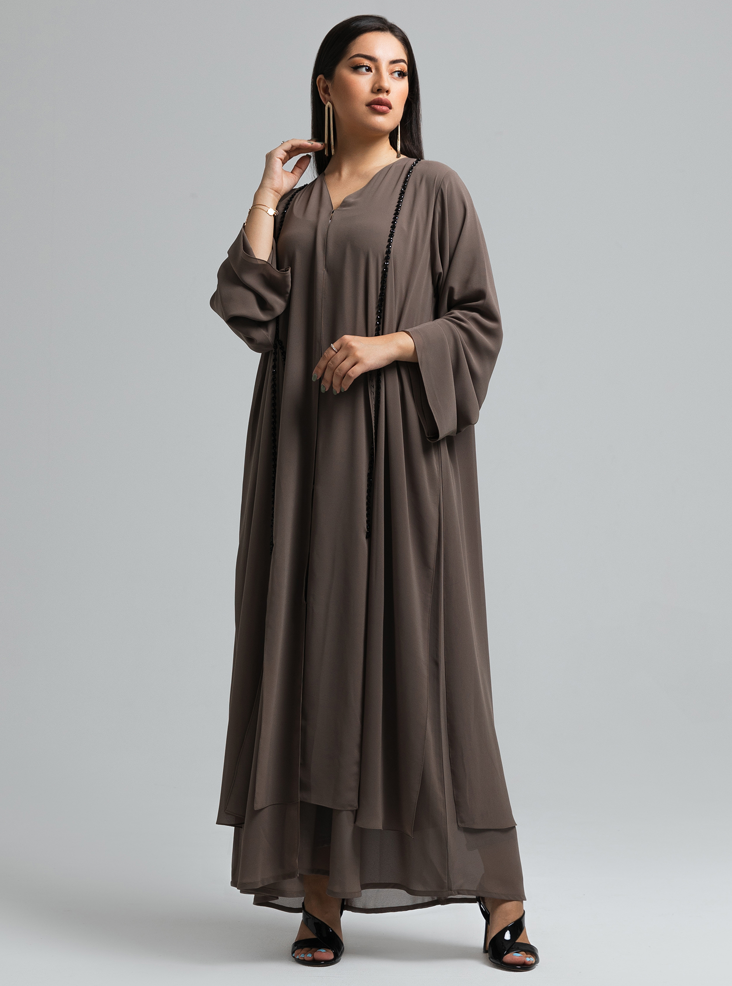 Khawla Flowy and layered chiffon abaya with hand crafted beading on the ...