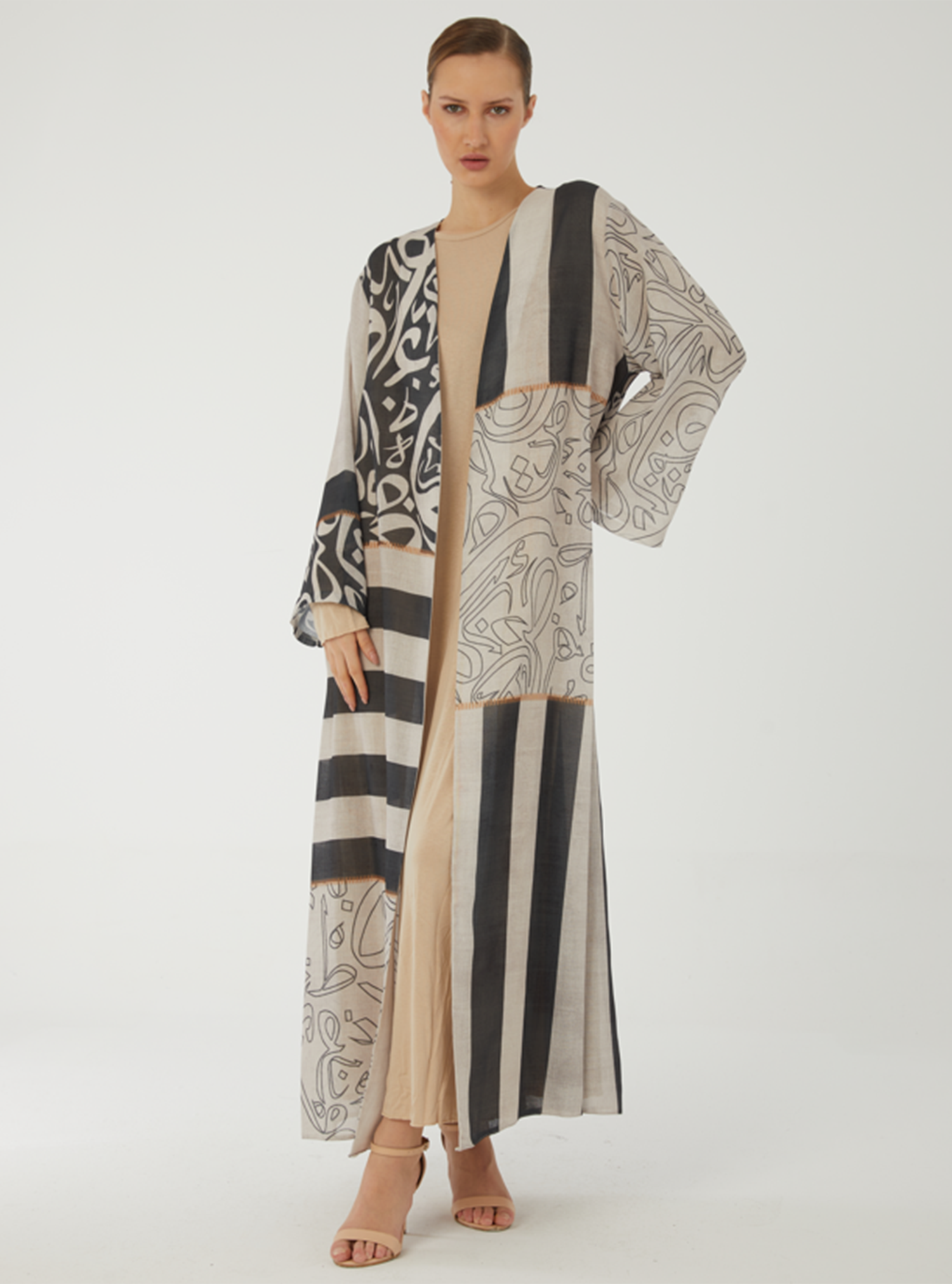 Bisht Abaya Crepe abaya featuring a unique printed design with a ...