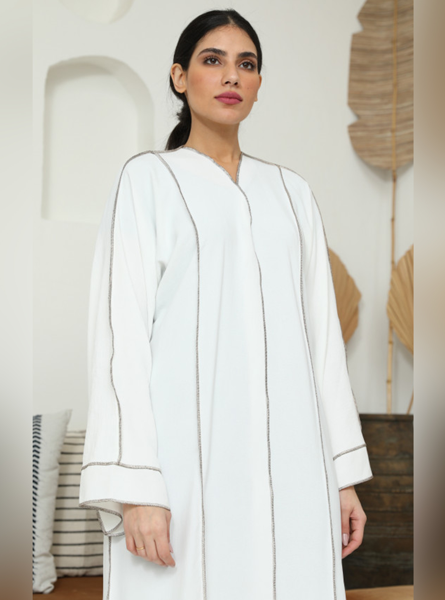 Mid Abaya 343 Decorated with copper colored cane on the front and on