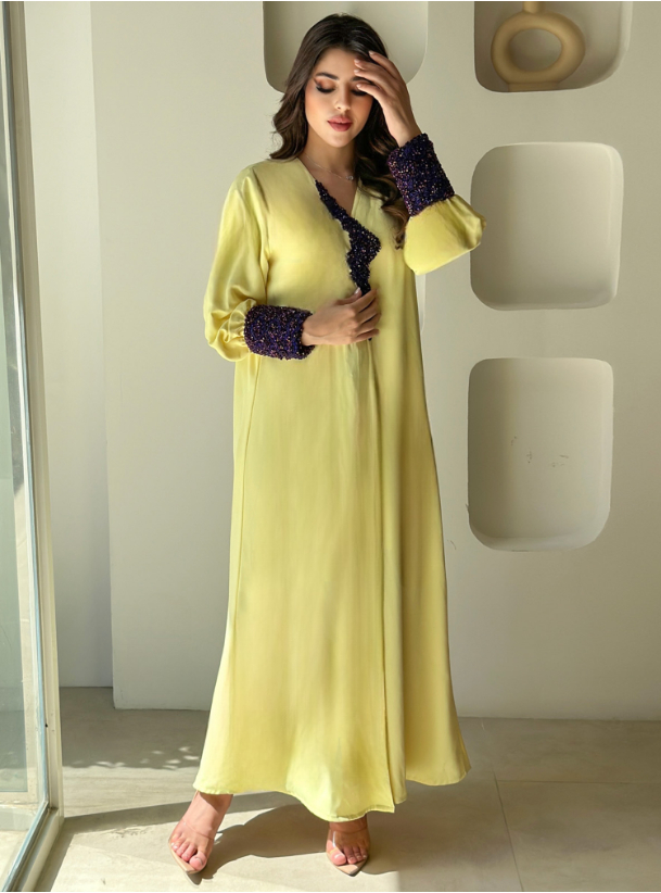 Yellow Abaya Yellow abaya with cuffed sleeves, adorned with ...