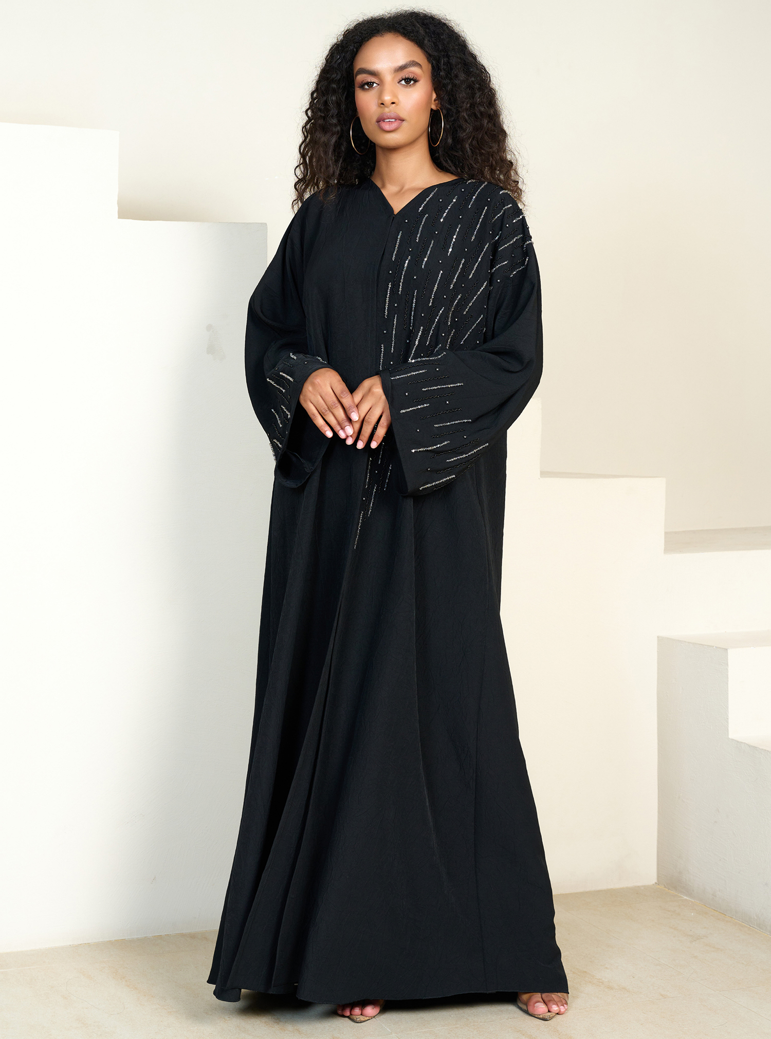Sparkle abaya Glamorous black abaya adorned with sparkling details for ...