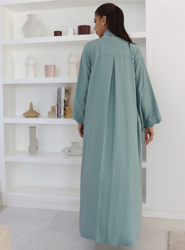 E7 Abaya Casual Abaya Collection, featuring a subdued cyan minimalist ...